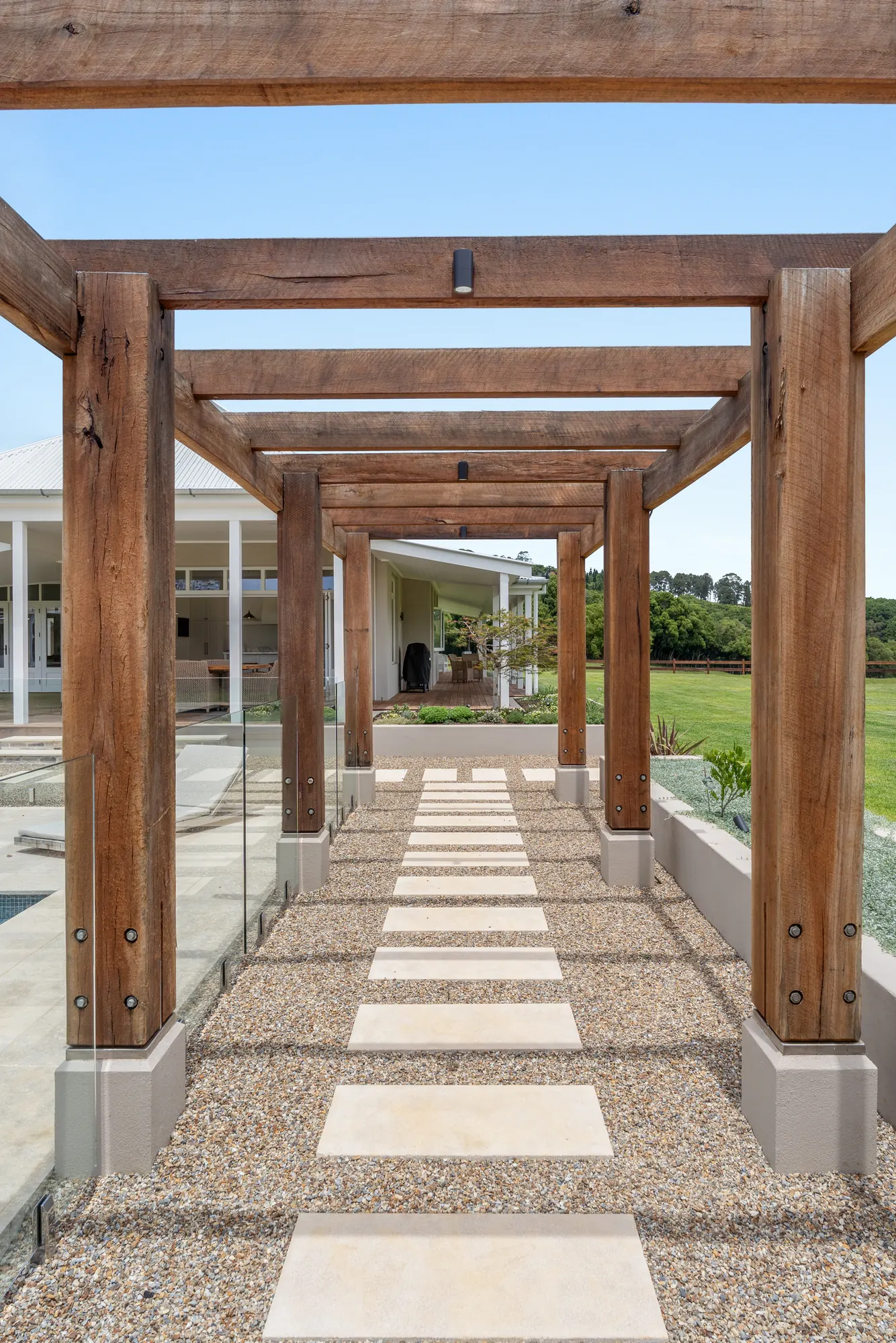 Timber pergola over a stepping stone path