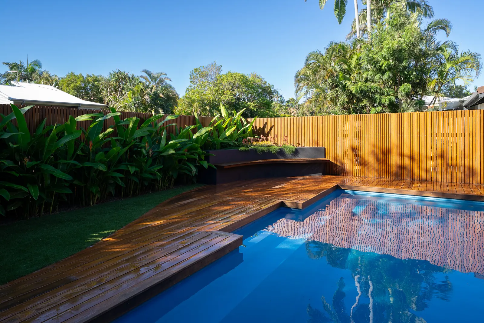 A pool, hardwood deck and rendered bench, built as one